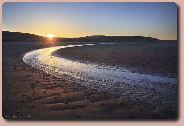 Tidal waters flowing into the Sea of Cortez at sunset.